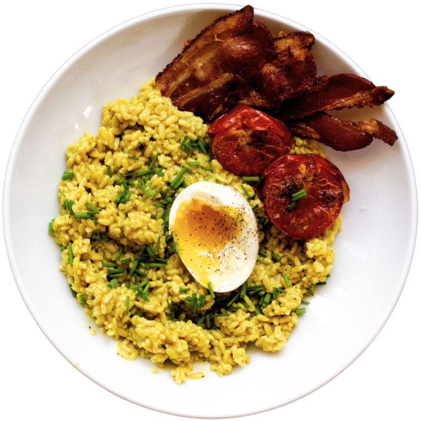 Rice alternative RightRice, breakfast bowl topped with a soft boiled egg, roasted tomatoes and a side of bacon
