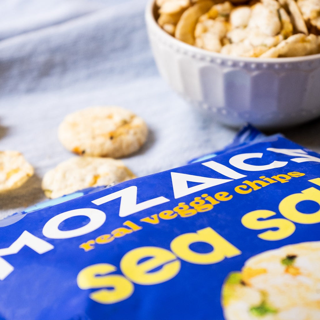 Healthy snack Mozaics, open packet of Mozaics Chips in Sea Salt with a bowl of Mozaics