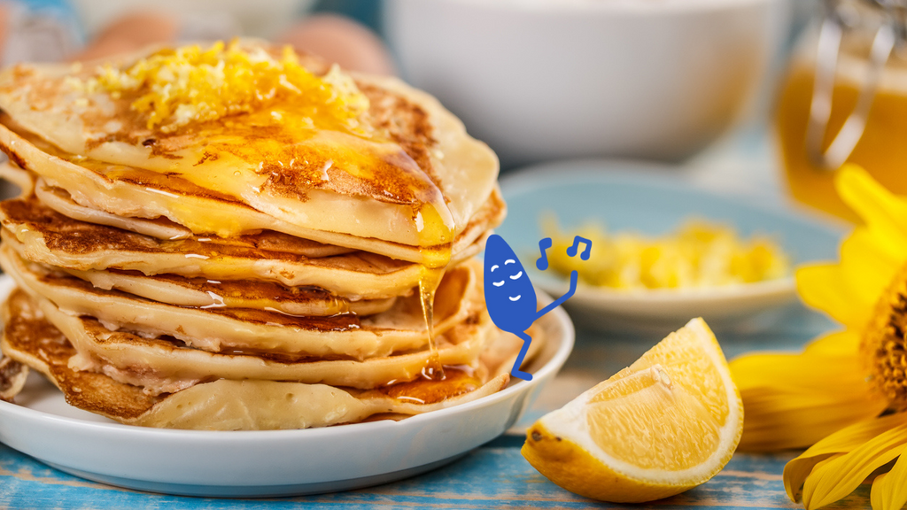 Dairy alternative Hope and Sesame Sesamemilk, stack of lemon pancakes on a plate made with Sesamemilk