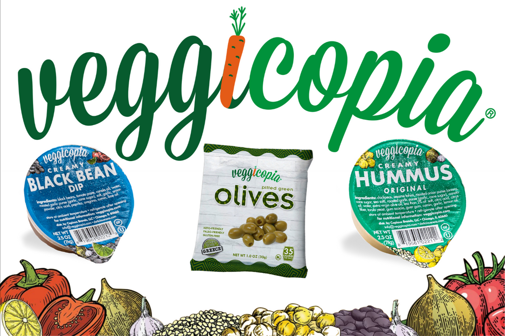 Snacks by Veggicopia, includes a bottom banner of vegetables with the Veggicopia logo, product pakets shown are Creamy Black Bean Dip, Creamy Hummus and Pitted Green Olives
